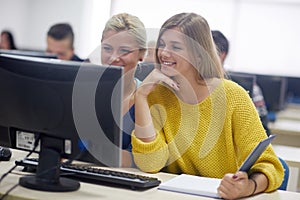 Students group in computer lab classroom