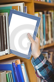 Students hand putting table in bookshelf