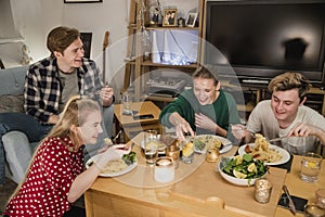 Students Having a Dinner Party