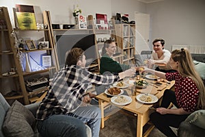 Students Having a Dinner Party