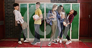 Students, high school friends and locker with phone for social media, education and learning support or handshake. Happy