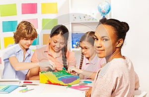 Students learning geography at the classroom