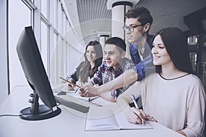 Students are Looking on Computer at University.