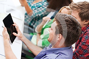 Students looking at tablet pc at school