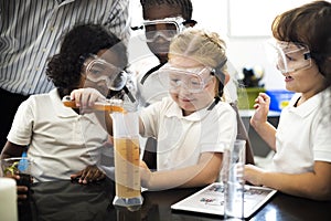 Students Mixing Solution in Science Experiment class