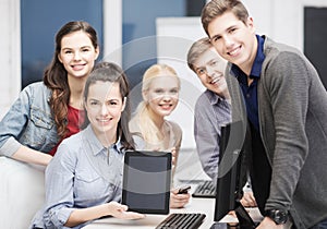 Students with monitor and blank tablet pc screen