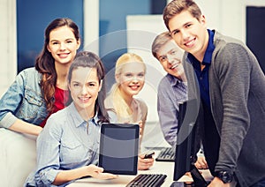 Students with monitor and blank tablet pc screen