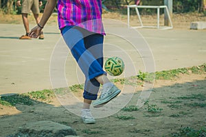 Students play sepak takraw at noon