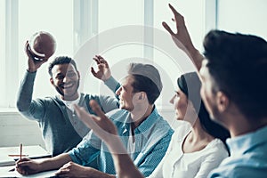 Students Playing with Rugby Ball in Classroom.