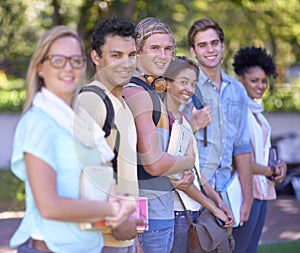 Students, portrait and happy on campus, row and scholarship opportunity at university with books. Friends, face and