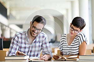 Students preparing together the examinations in a modern library