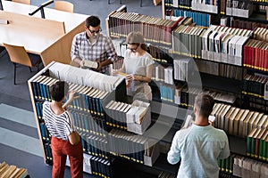 Students preparing together the examinations in a modern library