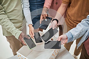 Students putting phones in box closeup