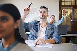 Students question, hand raise and classroom for learning, education or college with notebook on desk. College student