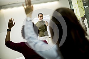 Students rising hands to answer the question during the workshop training