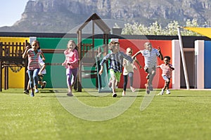 Students running in school playground