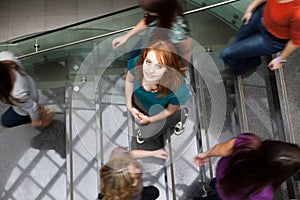 Students rushing up and down a busy stairway