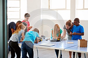 Students In After School Computer Coding Class Building And Learning To Program Robot Vehicle