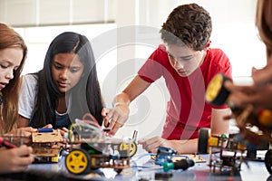 Students In After School Computer Coding Class Building And Learning To Program Robot Vehicle