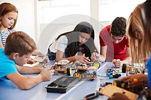 Students In After School Computer Coding Class Building And Learning To Program Robot Vehicle