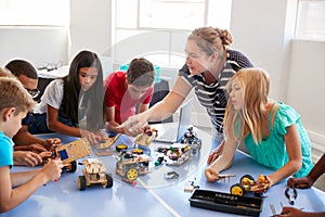 Students In After School Computer Coding Class Building And Learning To Program Robot Vehicle