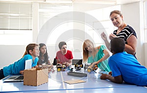 Students In After School Computer Coding Class Building And Learning To Program Robot Vehicle