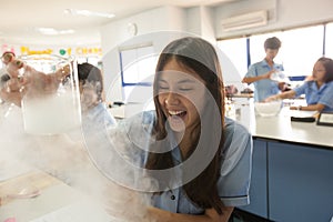 Students in science class, studying the reaction of dry ice