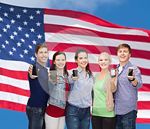 Students showing blank smartphones screens