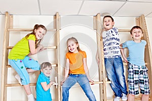 Students sitting on wall bars