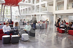 Students socialising in the lobby of modern university