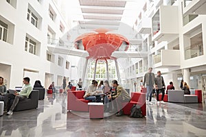 Students socialising in the lobby of modern university