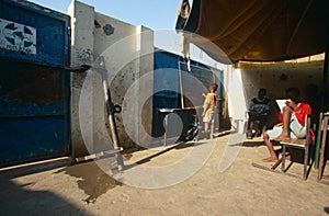 Students studying in a makeshift classroom, Angola