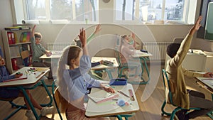 Students studying in school class. Cheerful kids having lesson in auditorium