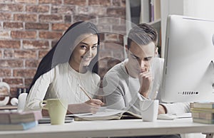 Students studying together at the library