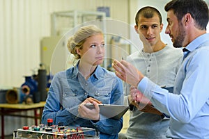 students taking notes in engineering laboratory