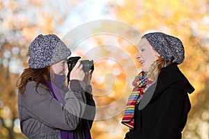 Students taking pictures outdoors fall