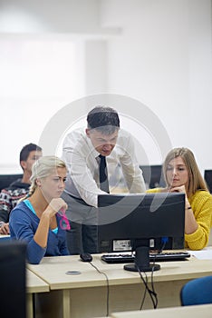 Students with teacher in computer lab classrom