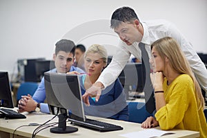 Students with teacher in computer lab classrom