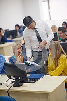 Students with teacher in computer lab classrom