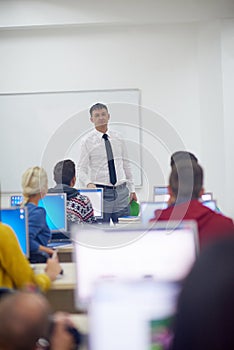 Students with teacher in computer lab classrom