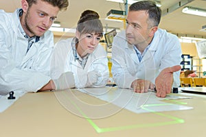 students and teacher in lab