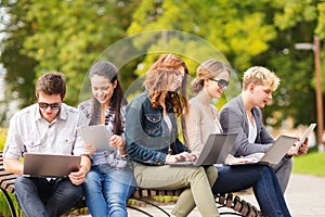 Students or teenagers with laptop computers