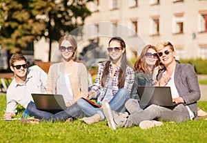 Students or teenagers with laptop computers