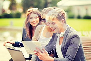 Students or teenagers with laptop computers