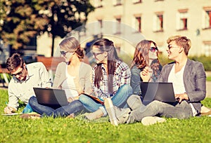 Students or teenagers with laptop computers