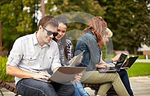 Students or teenagers with laptop computers