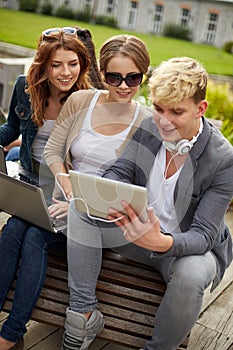 Students or teenagers with laptop computers