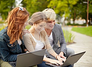 Students or teenagers with laptop computers