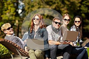 Students or teenagers with laptop computers