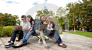 Students or teenagers with laptop computers